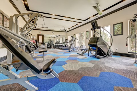 a fitness center with treadmills and other exercise equipment