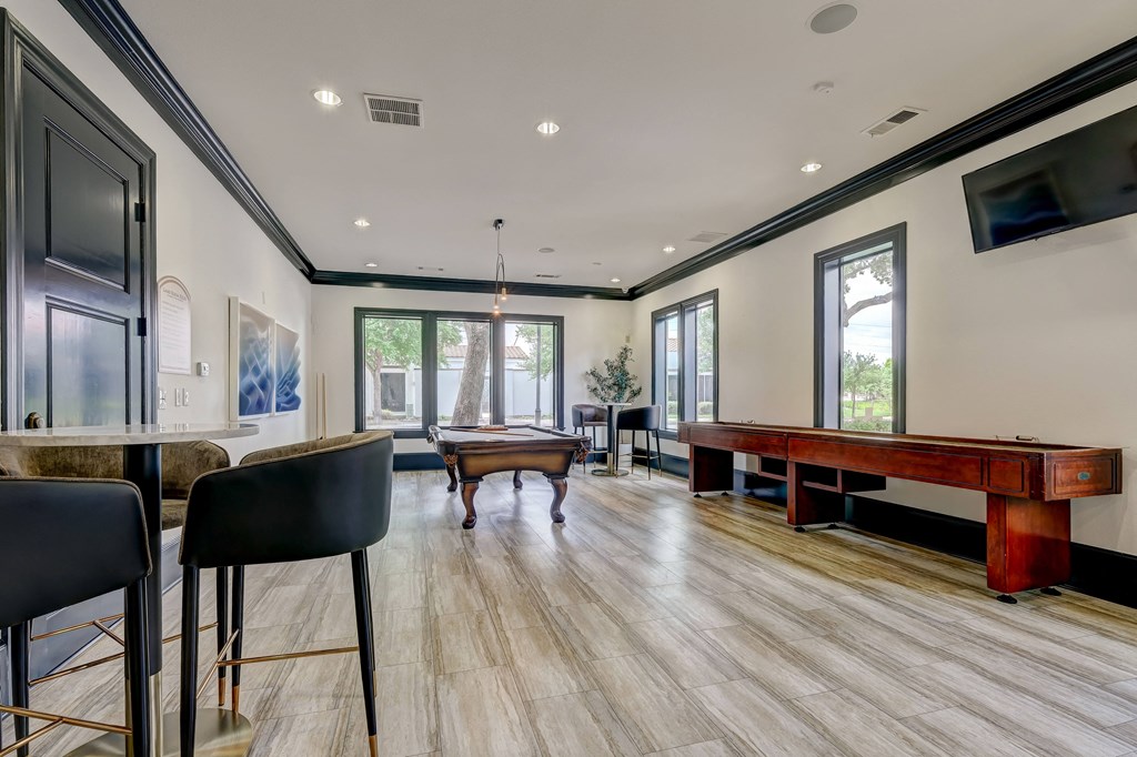 Resident game room with shuffleboard and pool table