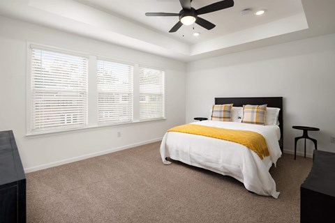 Primary Bedroom with king size bed and large window letting in nice natural light.