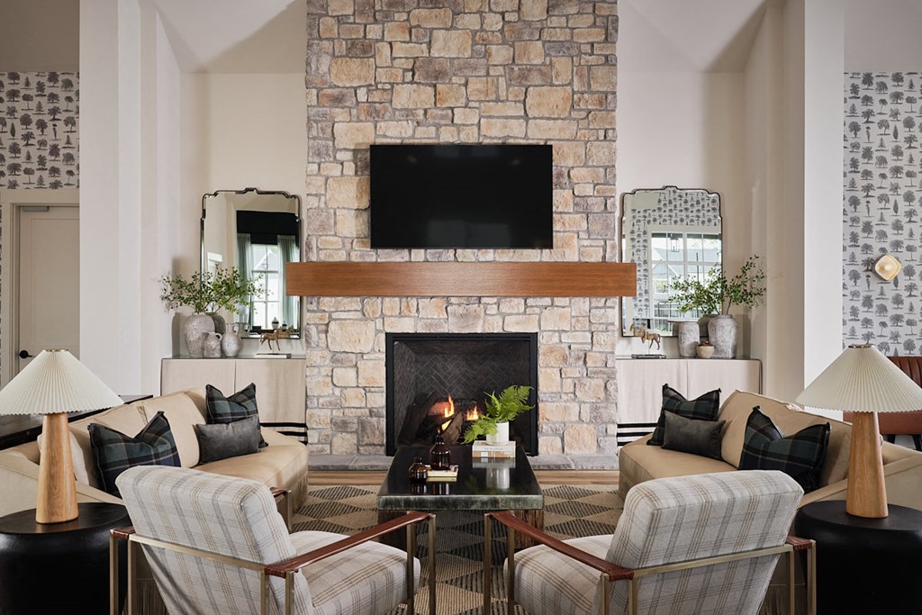 a living room with a fireplace and a tv above it