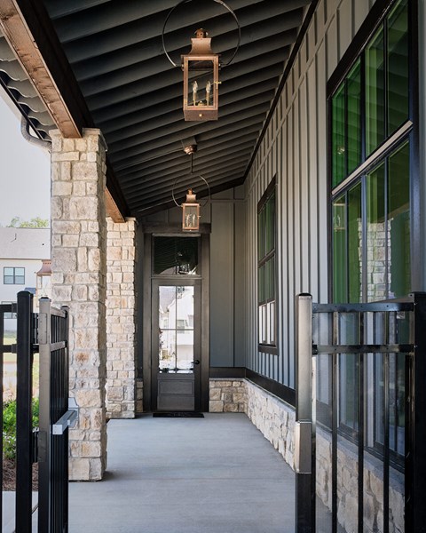 Front porch of the Clubhouse featuring a black ceiling and inviting entryway.