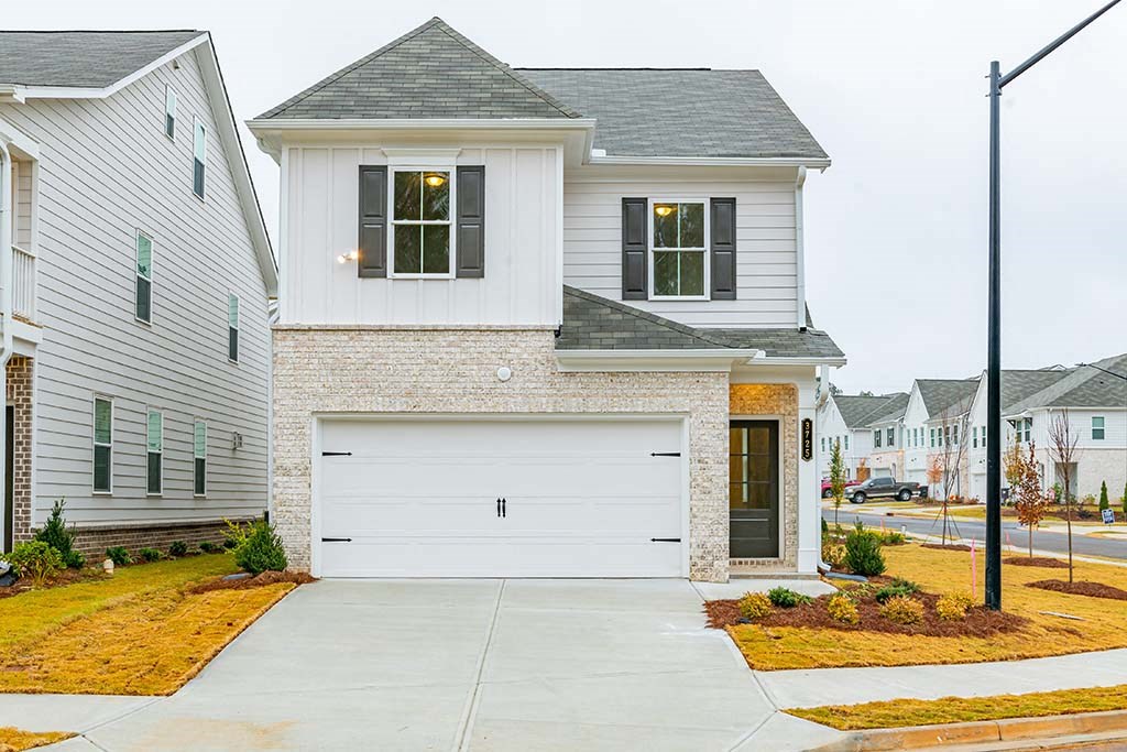 a white house with a gray roof