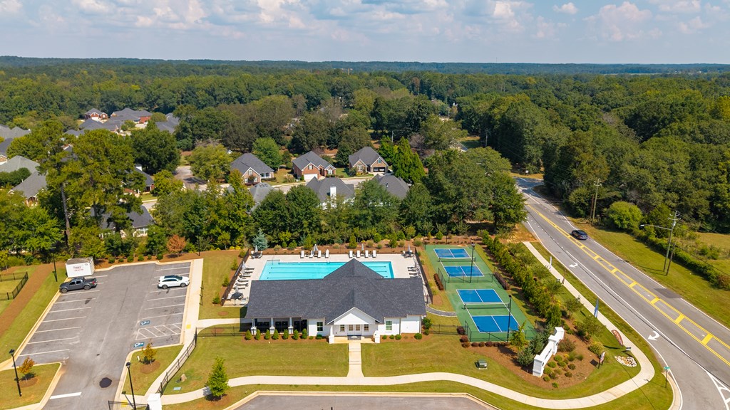 Bird’s-eye view showcasing the clubhouse and surrounding amenities.