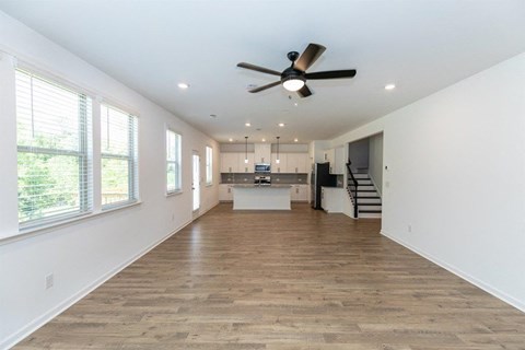 Spacious kitchen offering an elegant path to the stairwell.
