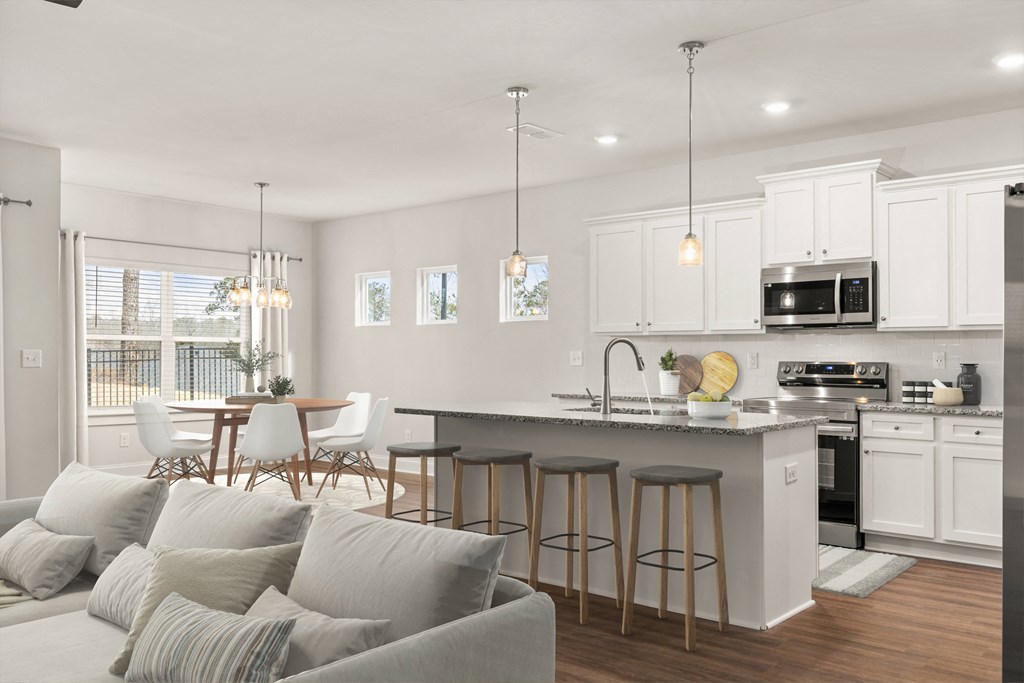 A view of the spacious kitchen and stainless steel appliances