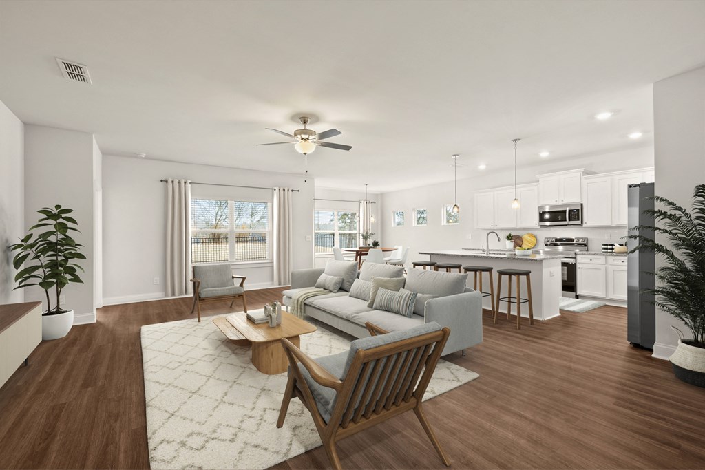 Living room with large window letting in a ton of natural light.