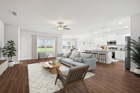 A modern living room with a grey sofa and wooden coffee table.