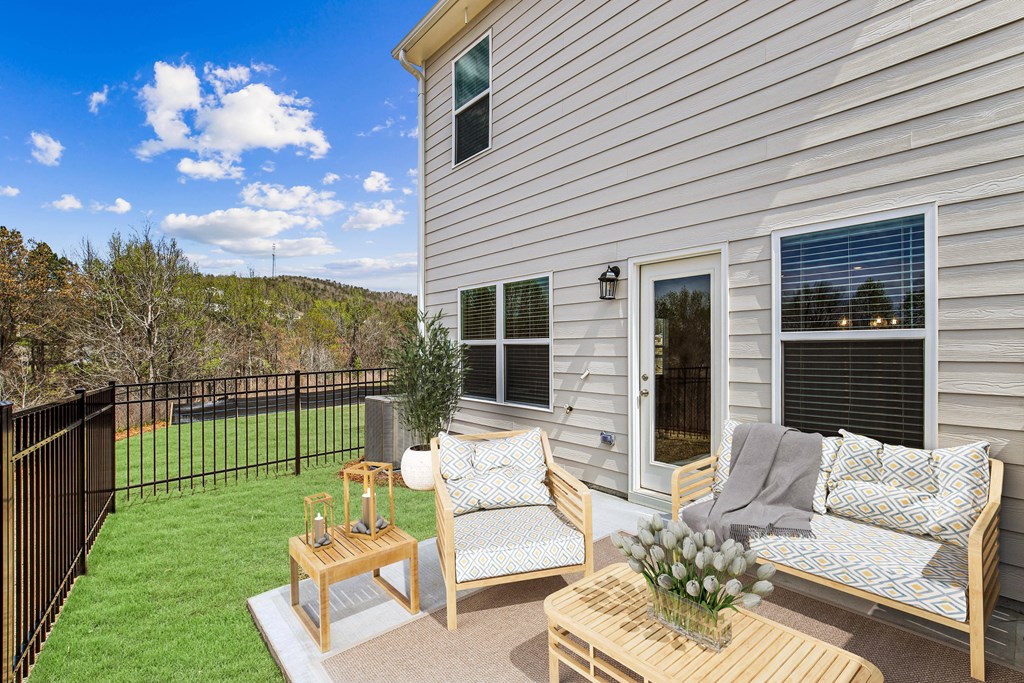 Back patio with fenced in yard.