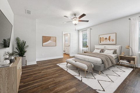 Primary Bedroom with king size bed and large window letting in nice natural light.