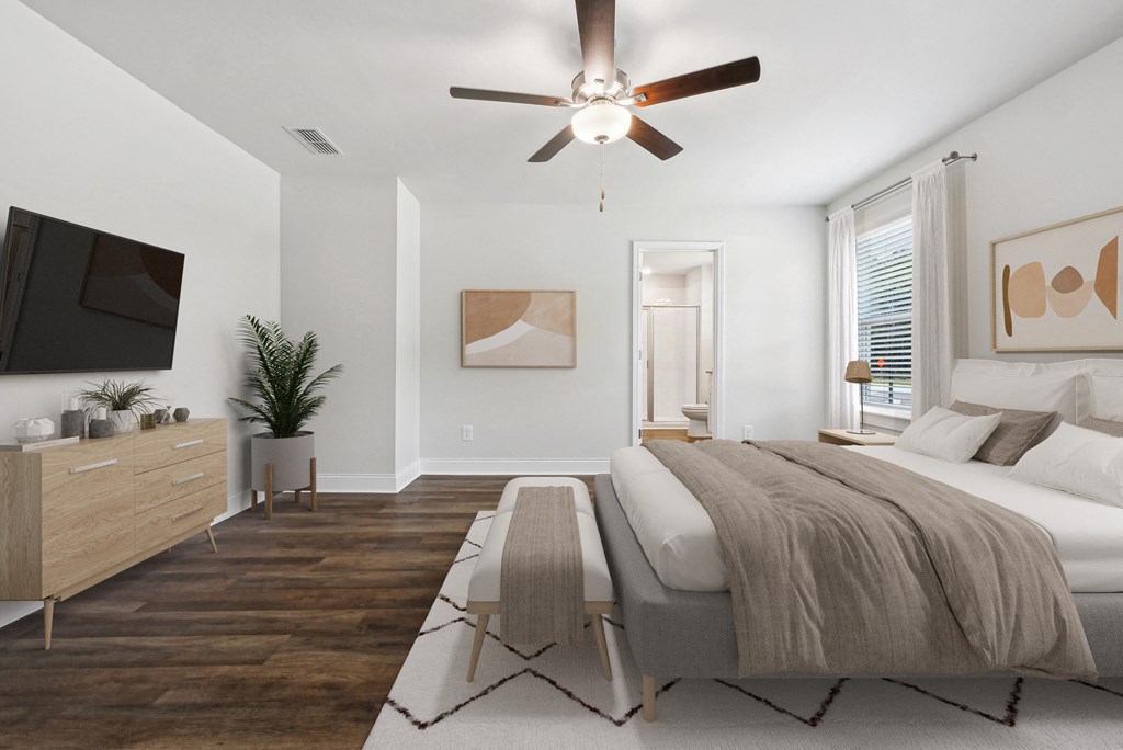 Spacious primary bedroom with a king bed and abundant natural light.