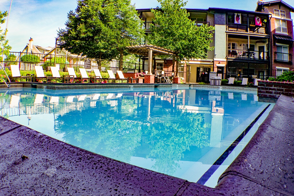 City Place at Westport - Outdoor Swimming Pool With Clear Water, Lounge Chairs, and Fenced Perimeter