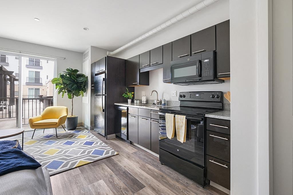 a kitchen with a stove and a microwave