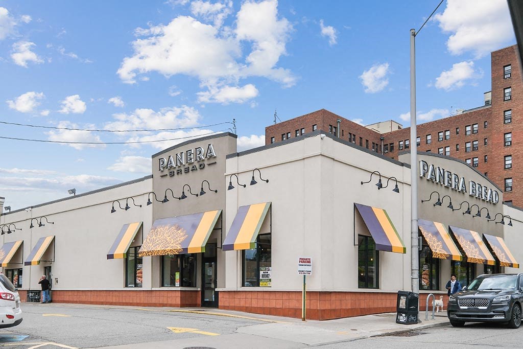 the exterior of a pantry bar on the corner of a street