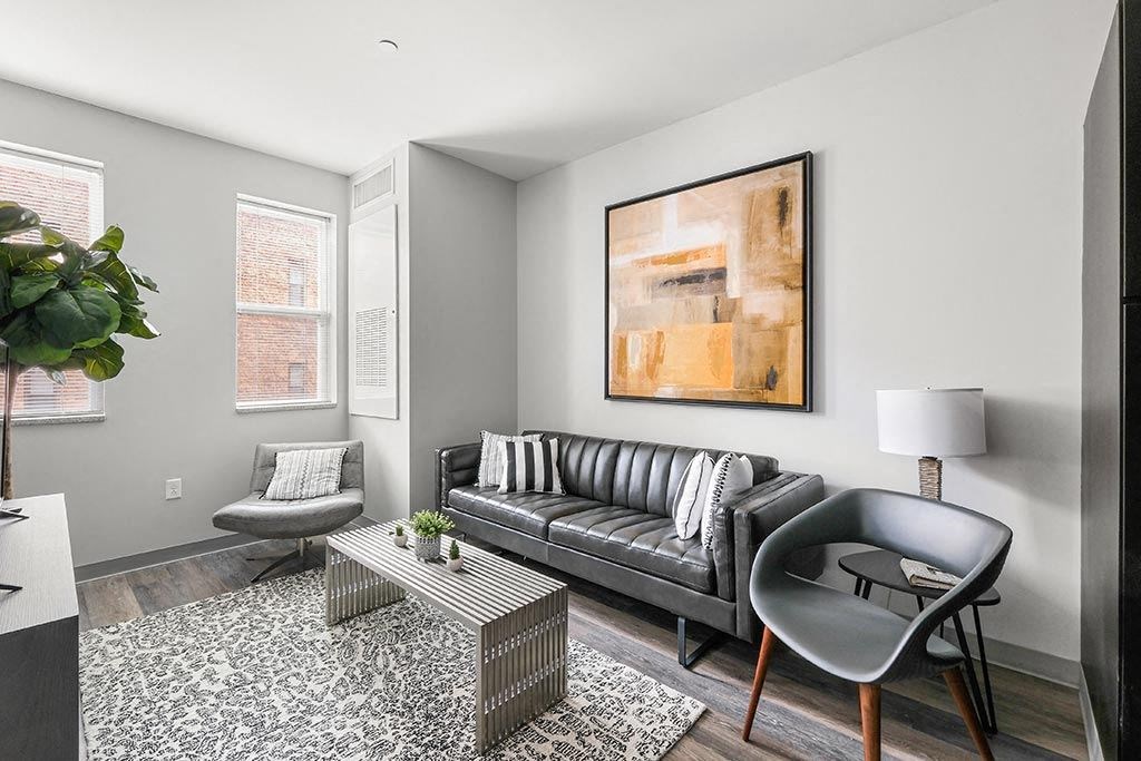 a living room with a couch and a chair