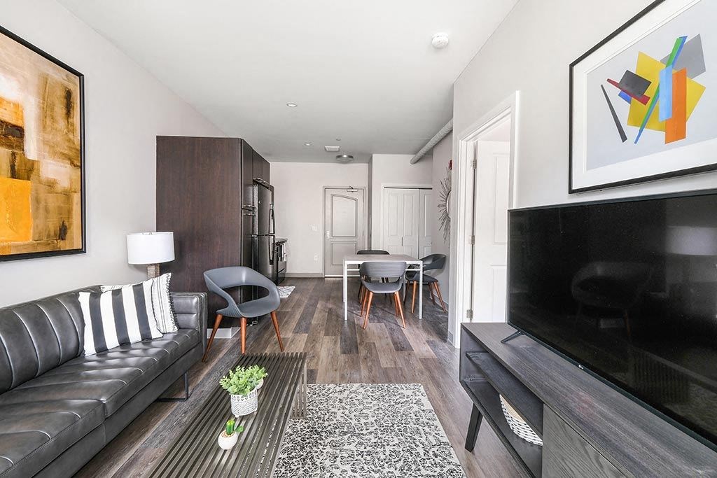 a living room with a couch and a tv