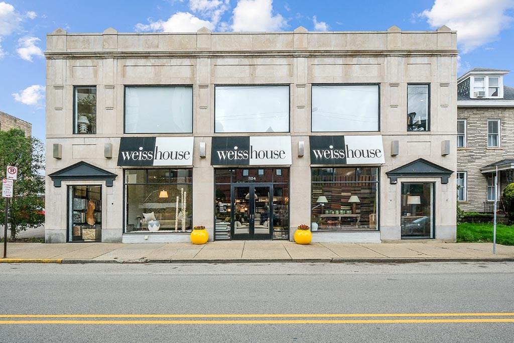 the front of a store on the side of a street