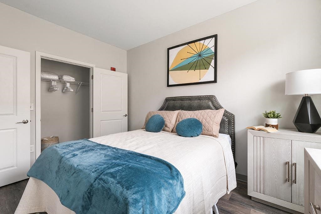 a bedroom with a bed and a closet