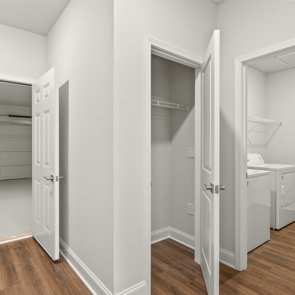 Functional space featuring a coat closet, washer & dryer, and garage access.
