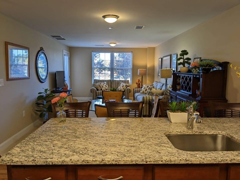 A kitchen with granite countertops and a sink.