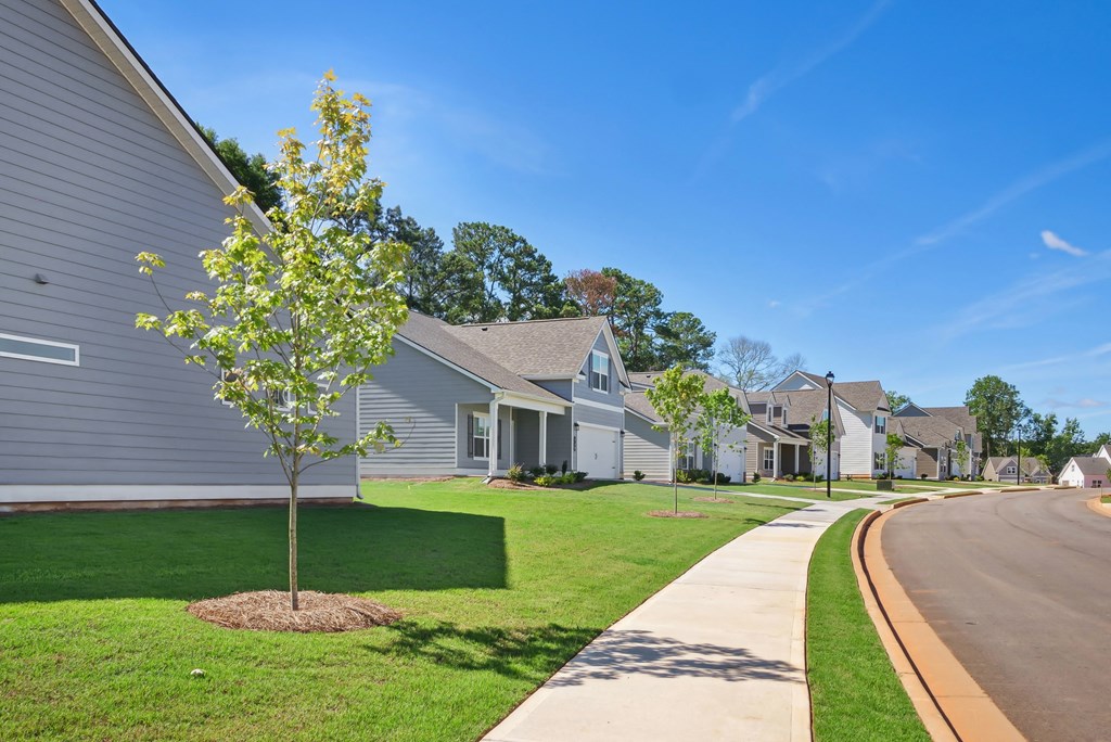 Exterior shot of Salem Oaks, two story homes with a private driveway and attached garage.