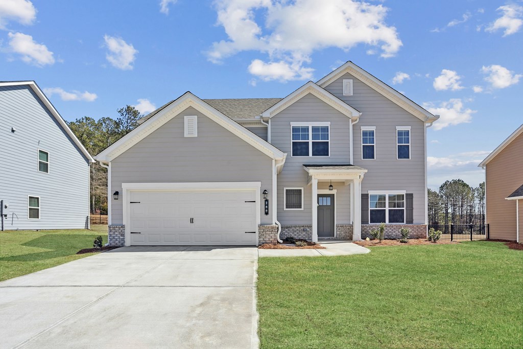 Exterior of the Southport, two story home with a private driveway and attached garage.