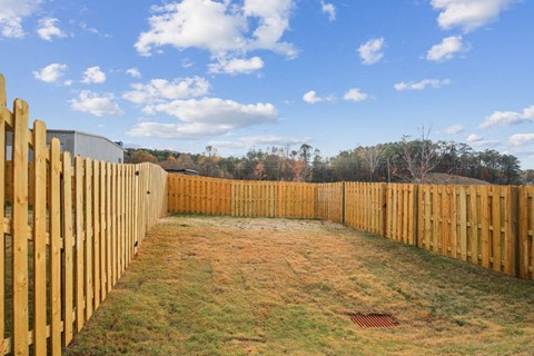 Another view of the fenced in backyard.