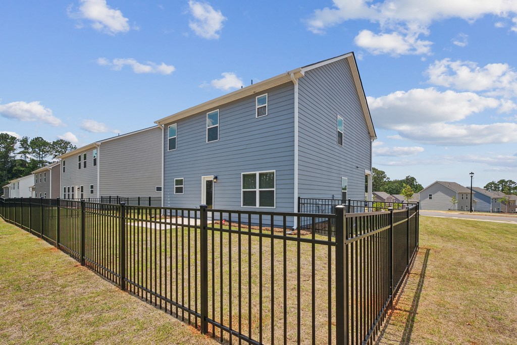 Another view of the back patio with fenced in yard.