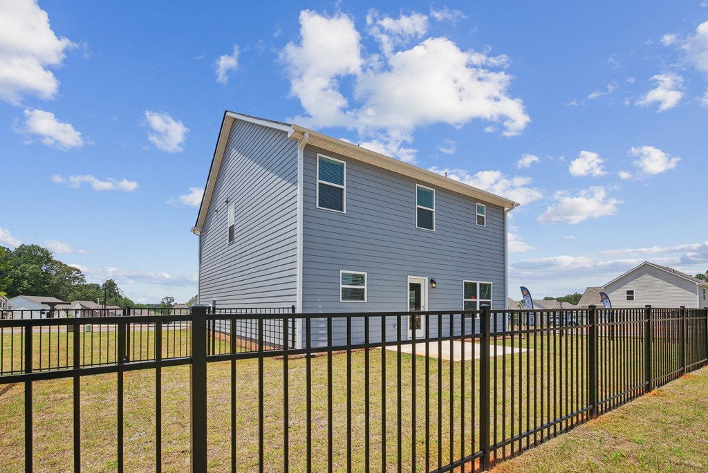 Back patio with fenced in yard.