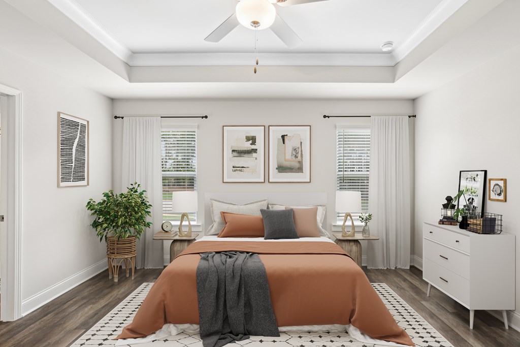 Primary bedroom with king size bed and large window.