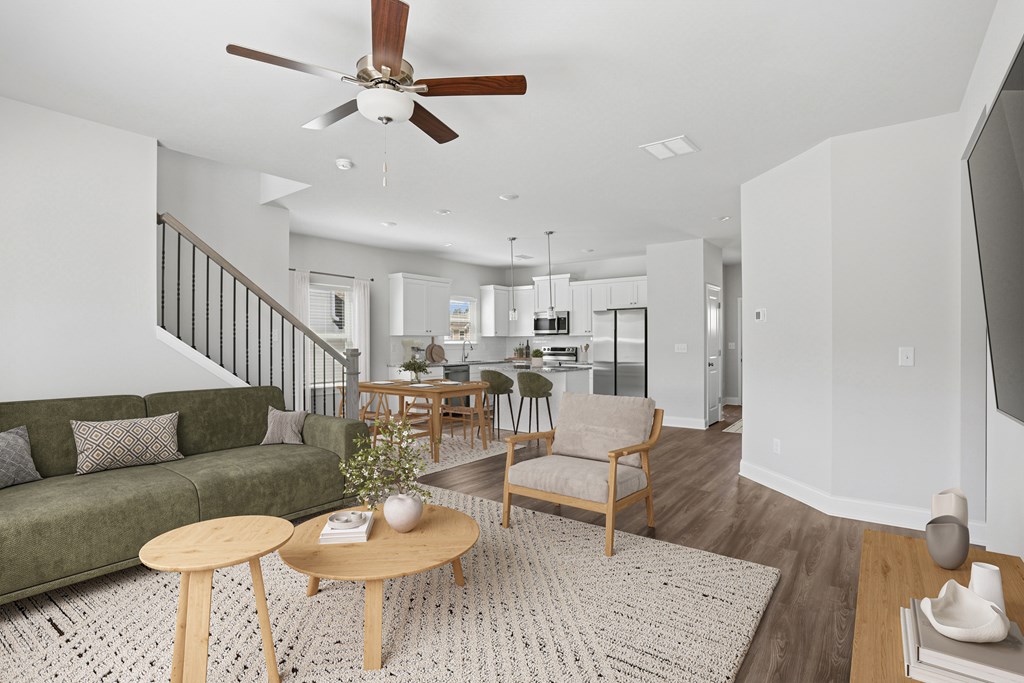 Living room with open view to kitchen and hallway.