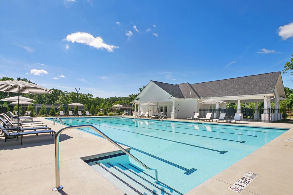 Poolside oasis featuring chic and comfortable seating.