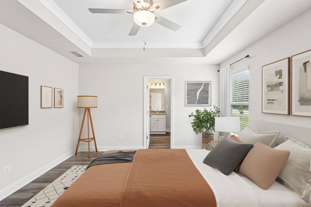 Primary Bedroom with king size bed and large window letting in nice natural light.