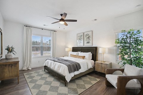 Spacious and calming primary suite with refined décor, a king bed, and nature-inspired accents.