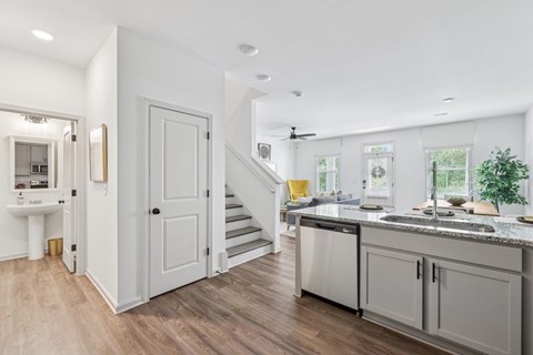 Spacious living area with easy access to the stairwell and upper levels.