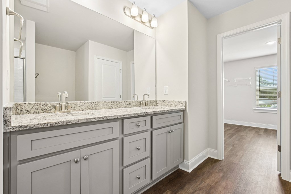 Elegant en suite with a double vanity off the primary bedroom.