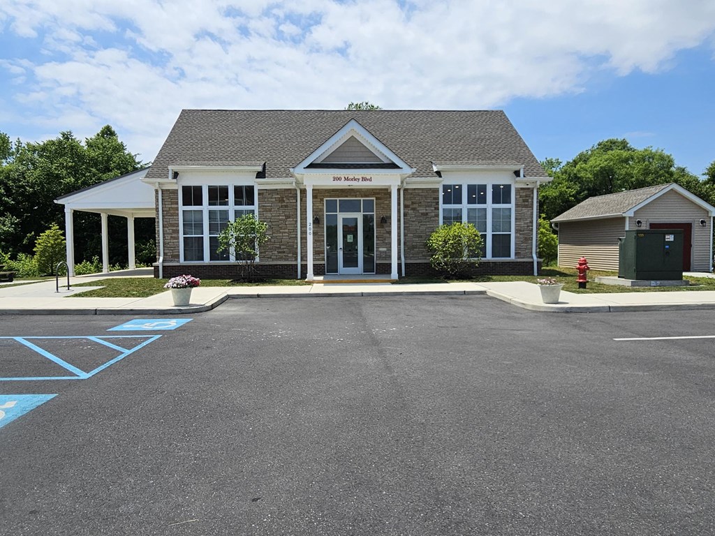 a building with a parking lot in front of it