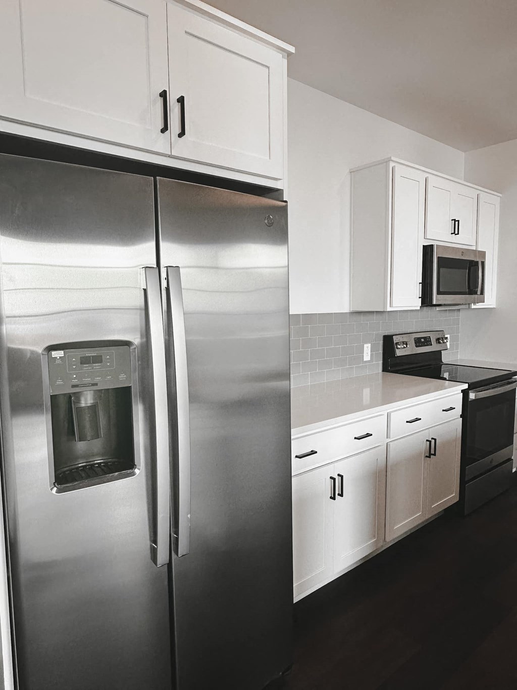 a kitchen with white cabinets and stainless steel appliances at The Mill at Prattville, Prattville, 36067