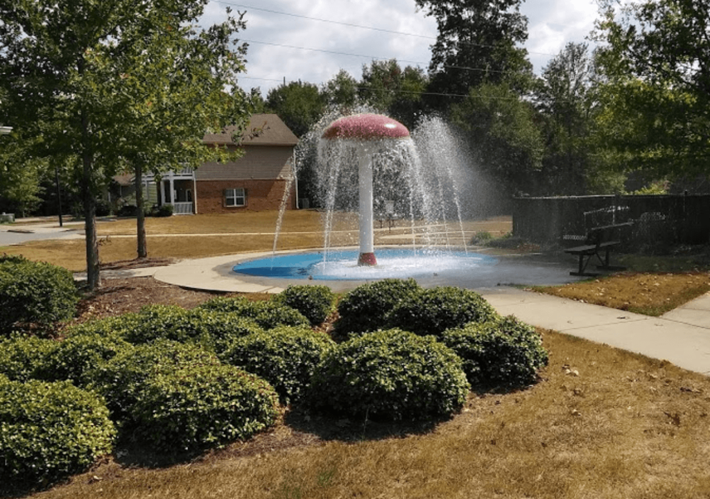 a fire hydrant spraying water into a fountain