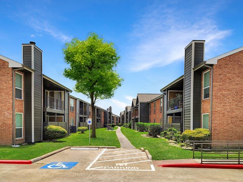A row of apartment buildings with a clear sky above.