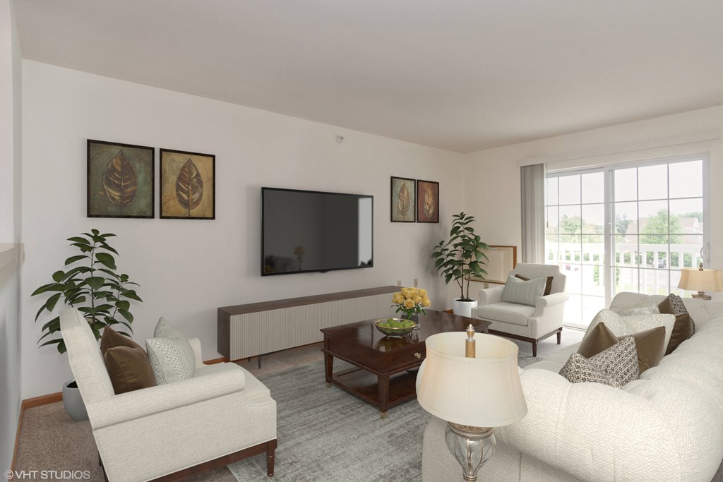 A living room with a white couch, a coffee table, and a flat screen TV.