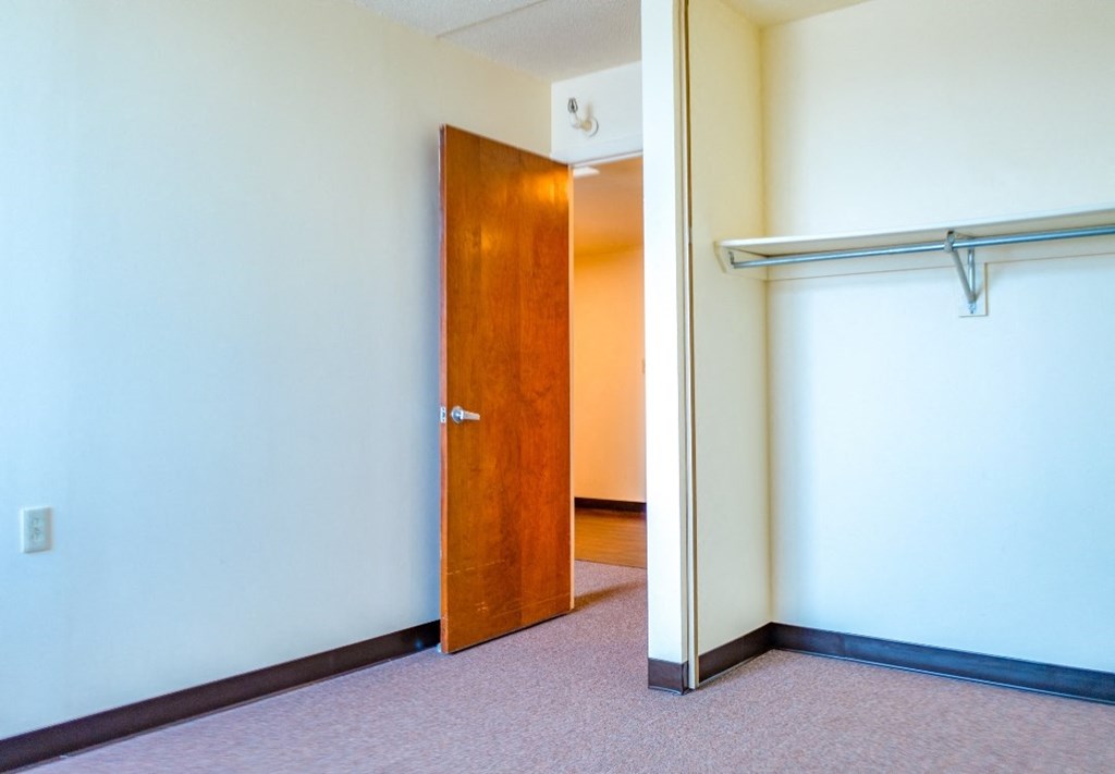 an open door in a room with a white wall