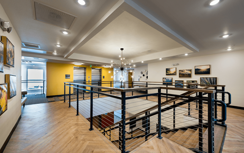a large room with a ping pong table in the middle