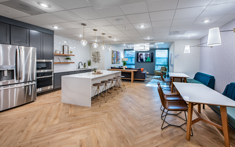 a kitchen and dining room with a table and chairs