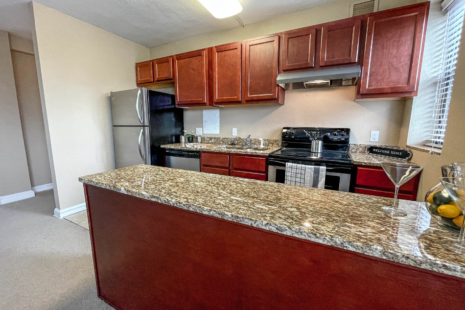 a kitchen with a granite counter top and