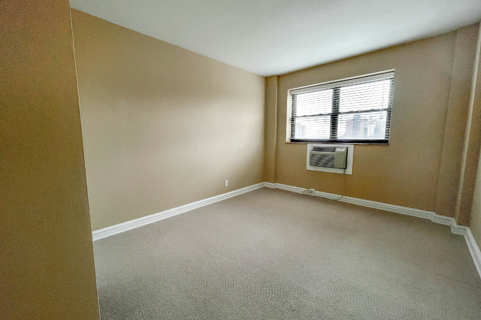 an empty room with a window in it