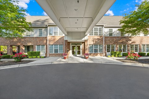 A building with a driveway in front of it.