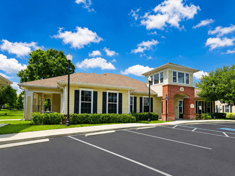 A building with a parking lot in front of it.