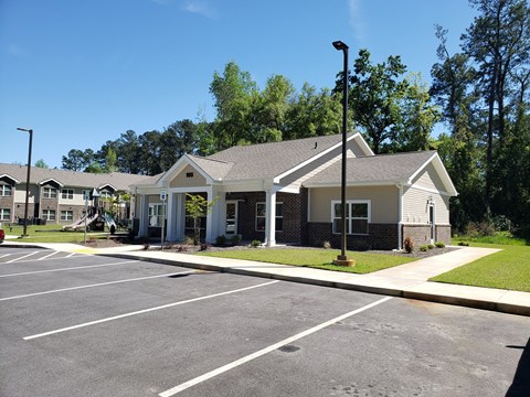 A parking lot with a building in the background.