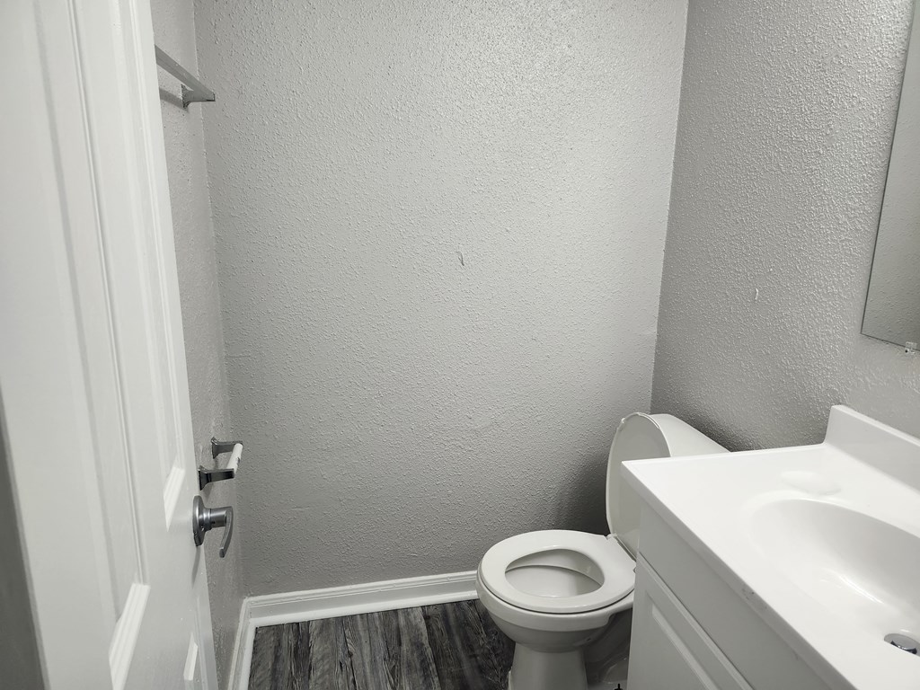 an empty bathroom with a toilet and a sink