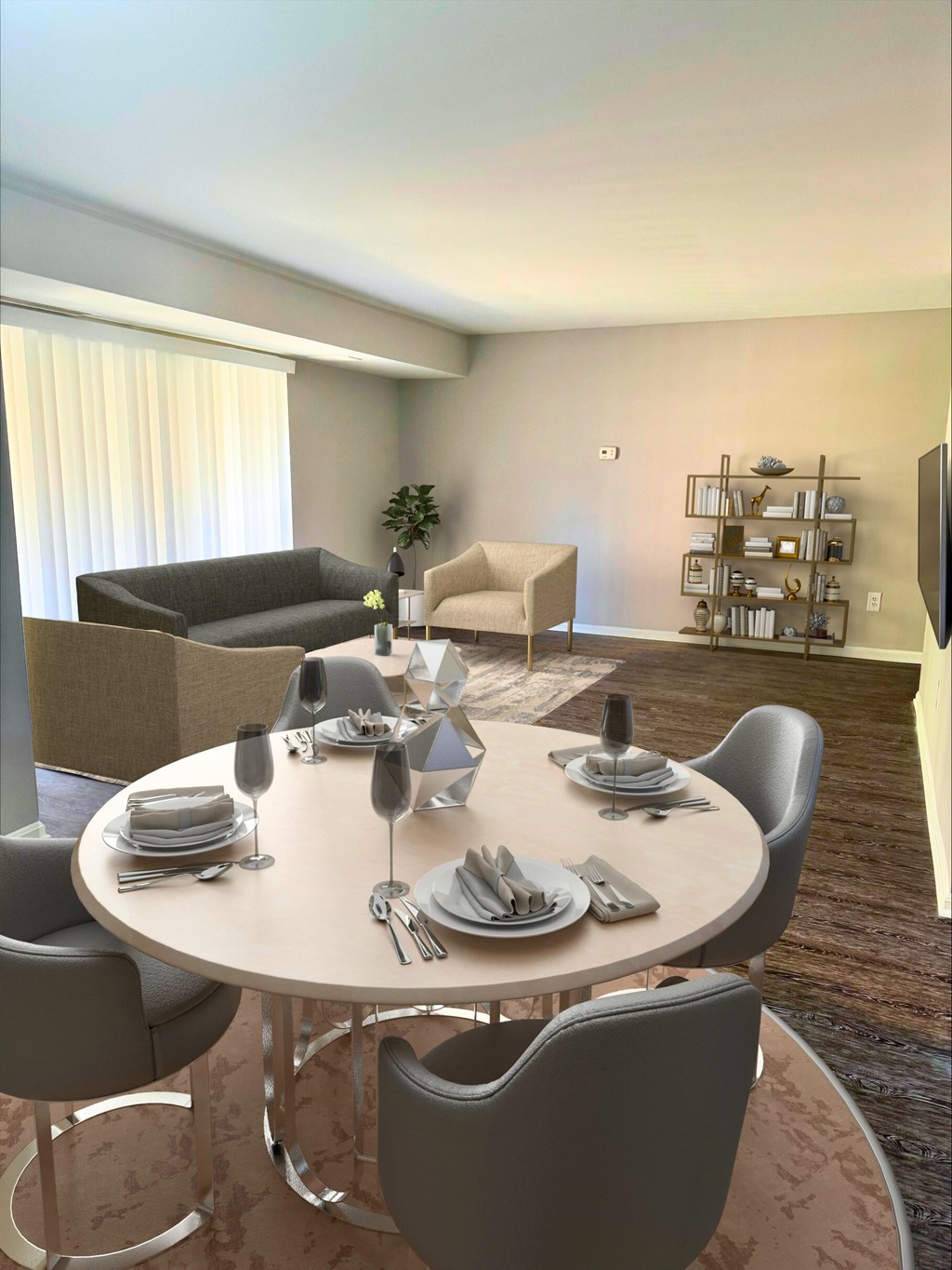A modern dining room with a round table set for six.